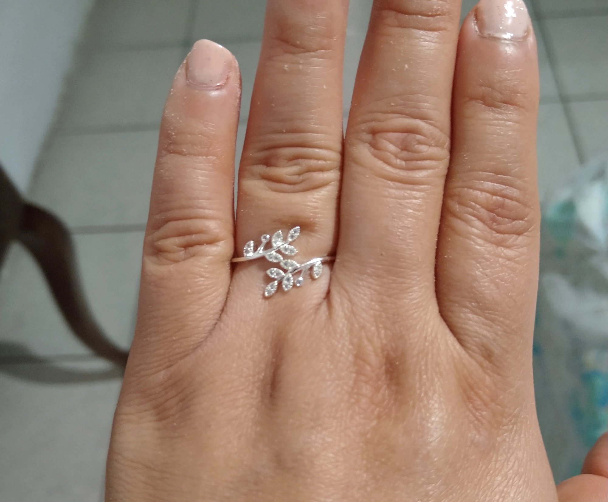 The olive leaf ring on a hand