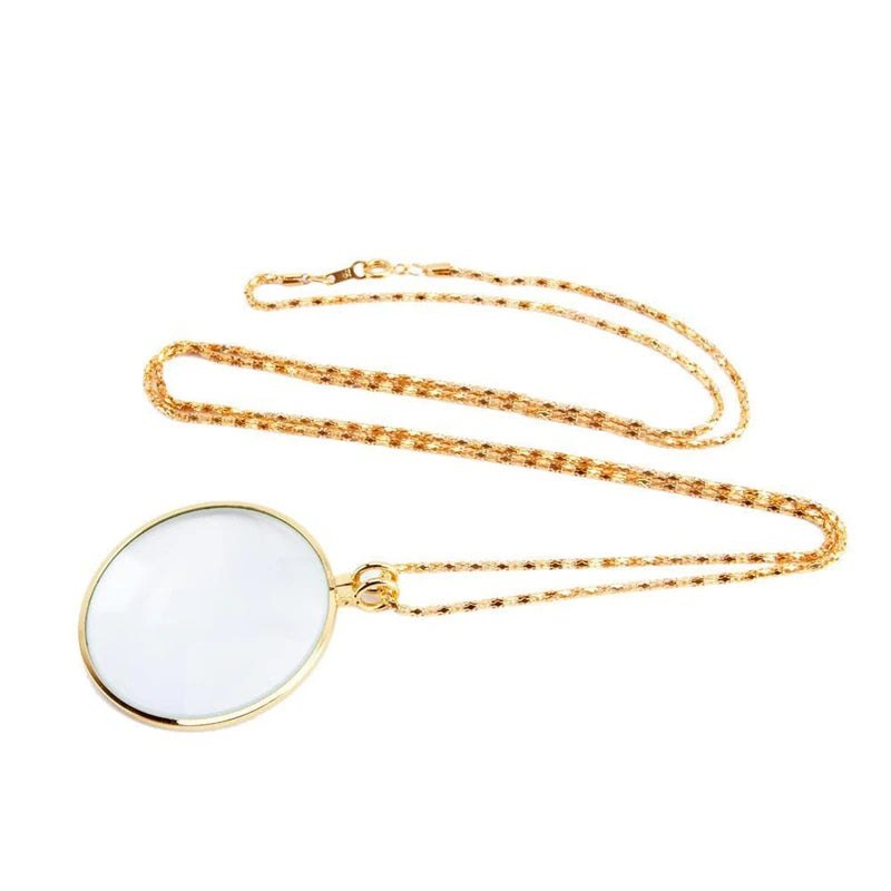 Magnifying Glass Necklace: a round glass lens in a metal frame, on a chain